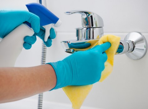 Trained cleaning staff preparing a carpet treatment in Kennington