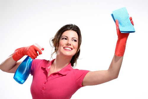 Local communal area cleaning team managing bin store and shared access space